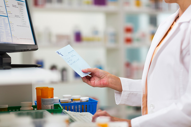 Pharmacist fulfilling prescription